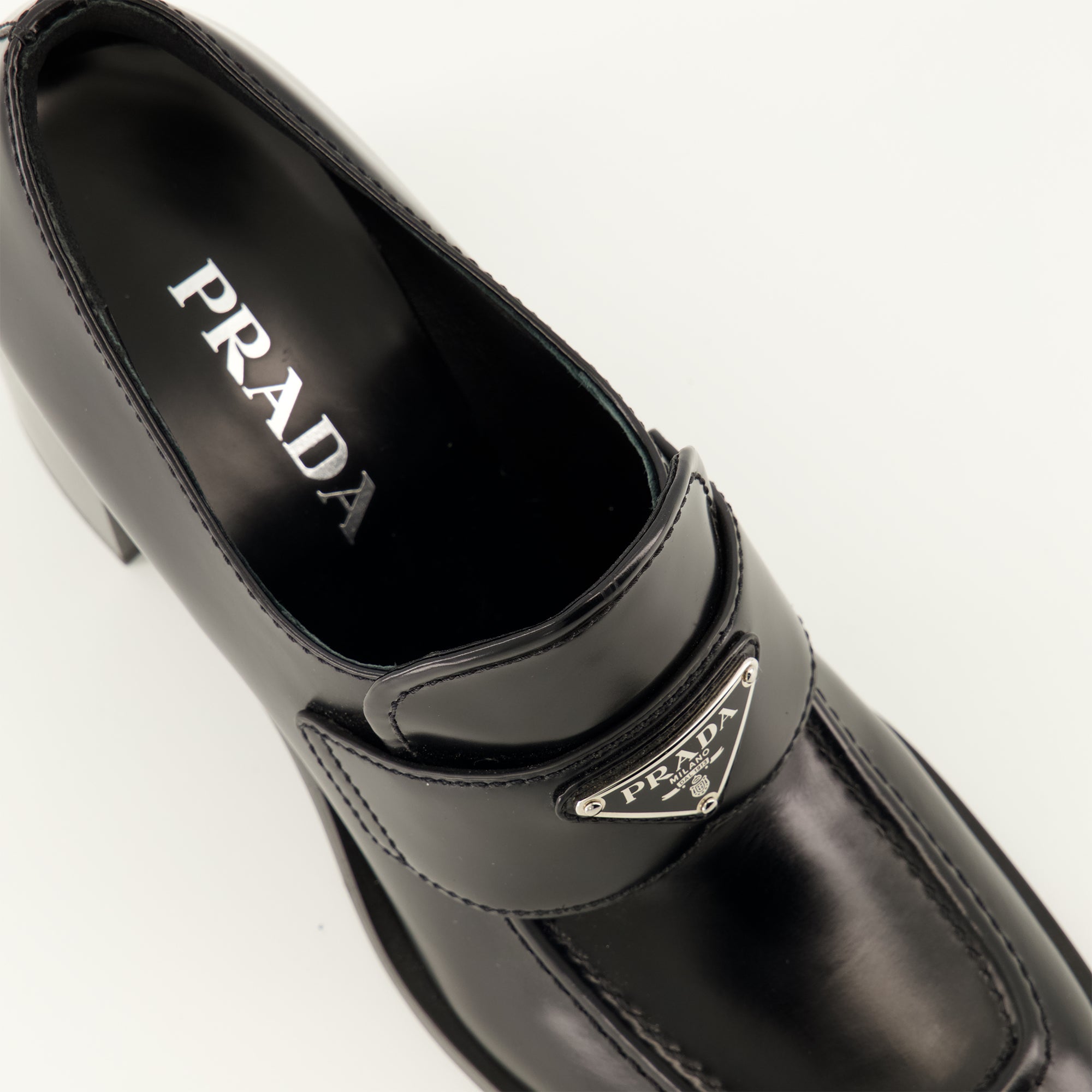 Loafers Heeled moccasins Prada Black Women