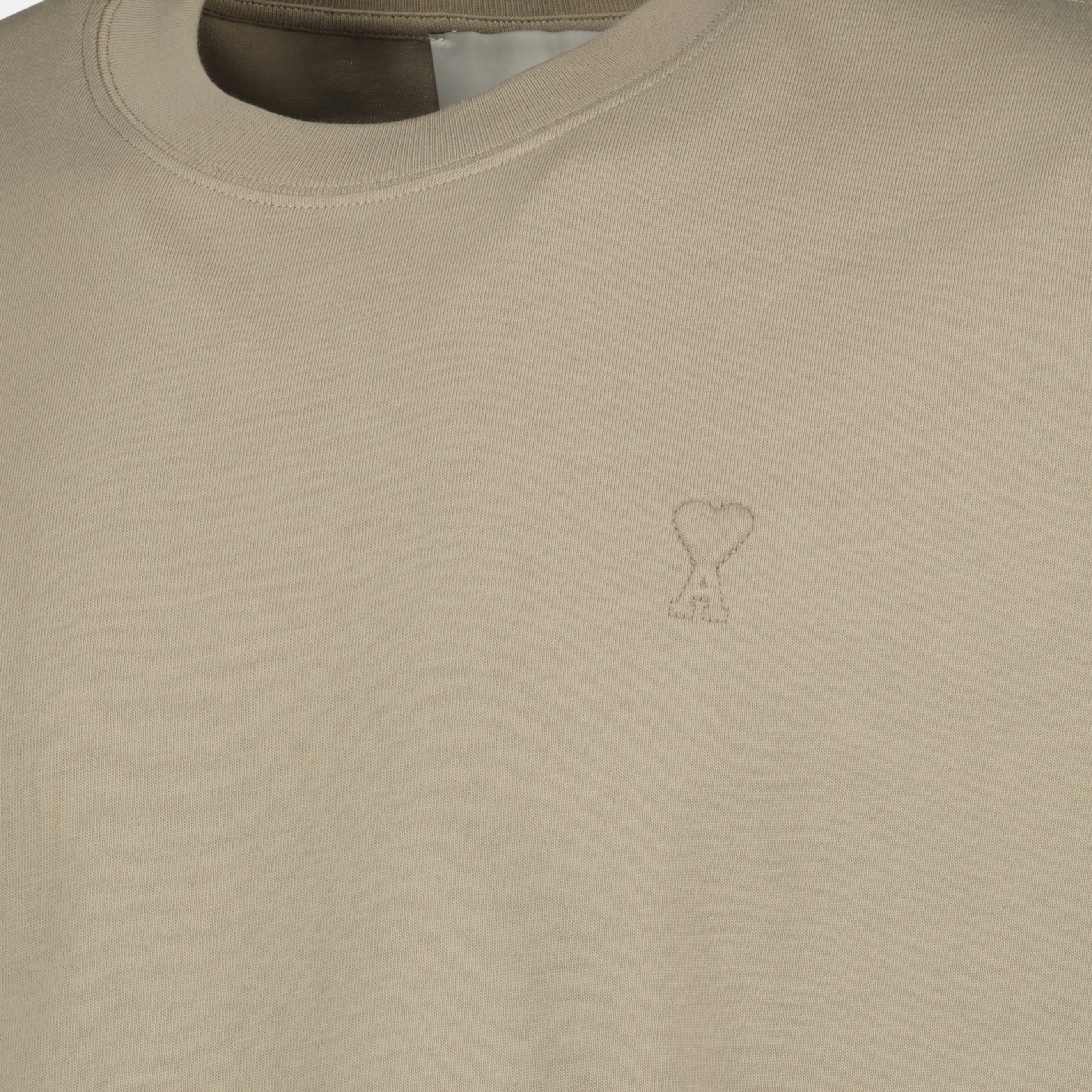 Image of the article Beige AMI Heart Cotton T-shirt from the brand Ami PARIS for Unisex - Spring-Summer 2026 Season - Detailed View_1