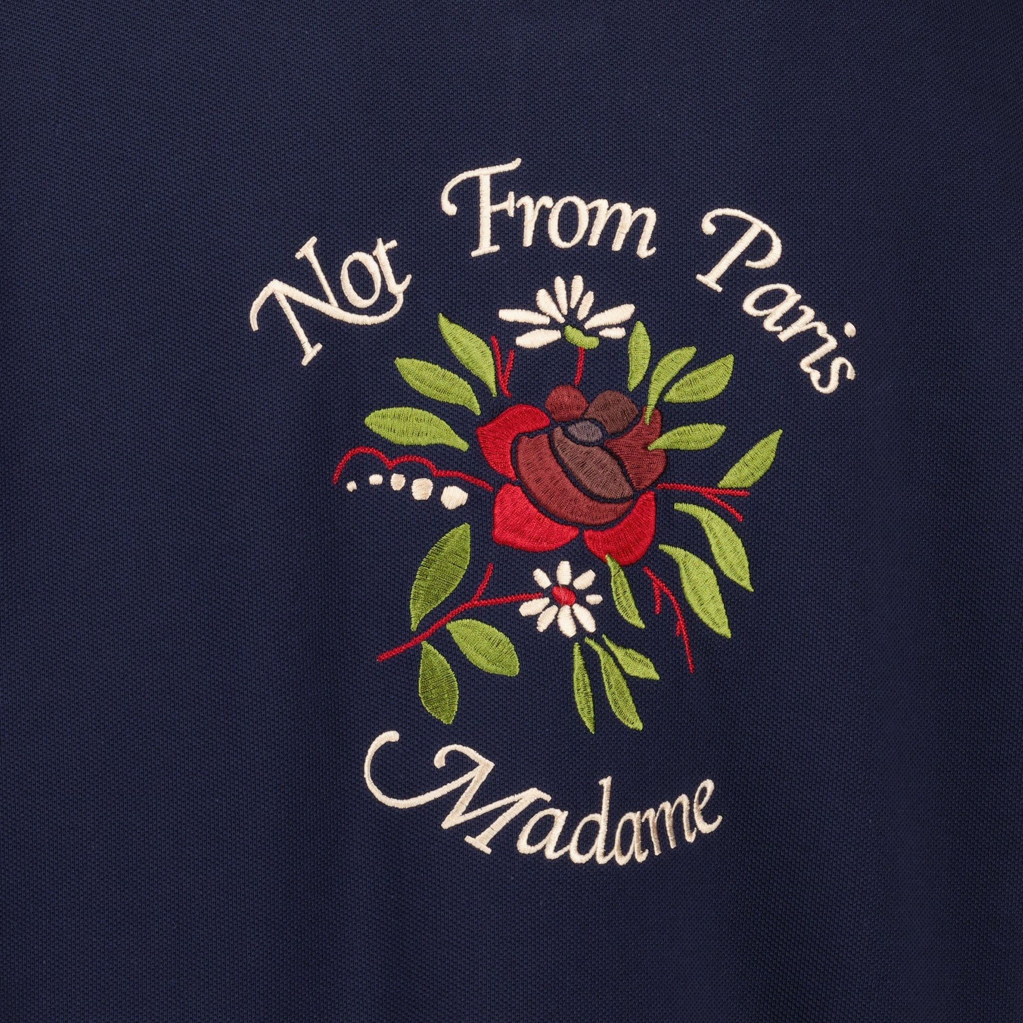 Image of the Cotton Piqué Shirt Slogan Navy Blue Pink from the brand Drole De Monsieur for Men - Spring-Summer 2026 - Detailed View_1