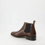 Image of the Pas Des Dieux ankle boots by Valentino Garavani for Men - Autumn-Winter 2025 Season - Three-quarter back-right view