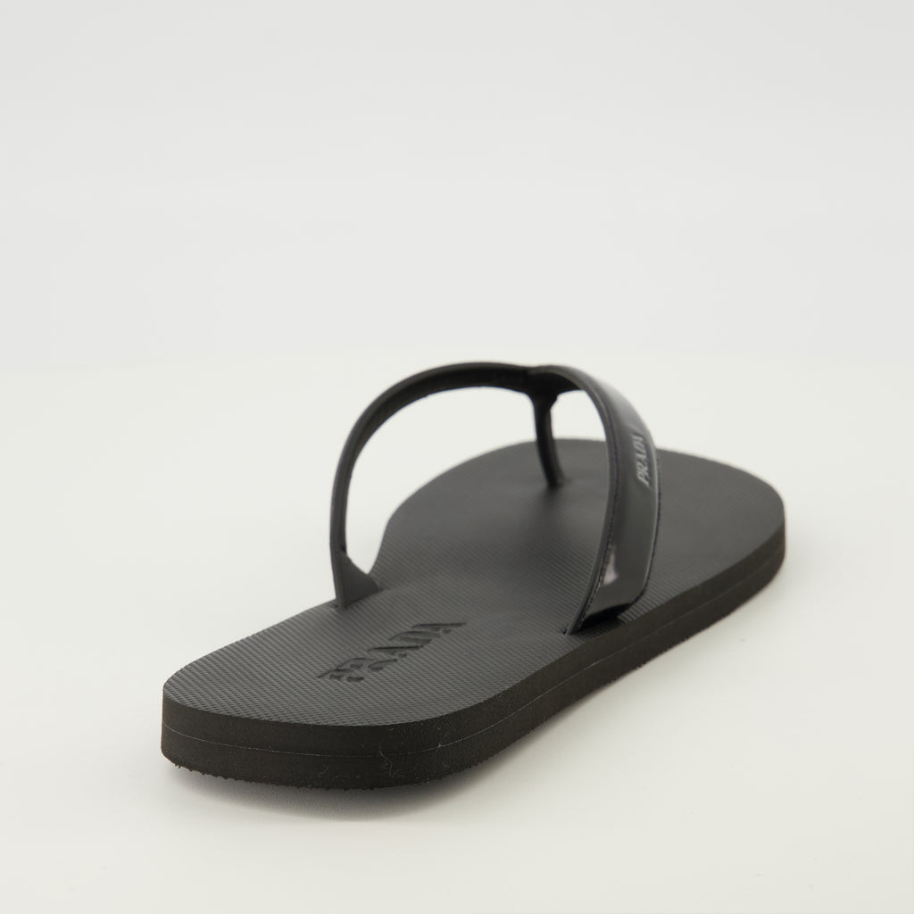 Image of the article Black brushed leather flip flops by Prada for Men - Spring-Summer 2026 - Back view
