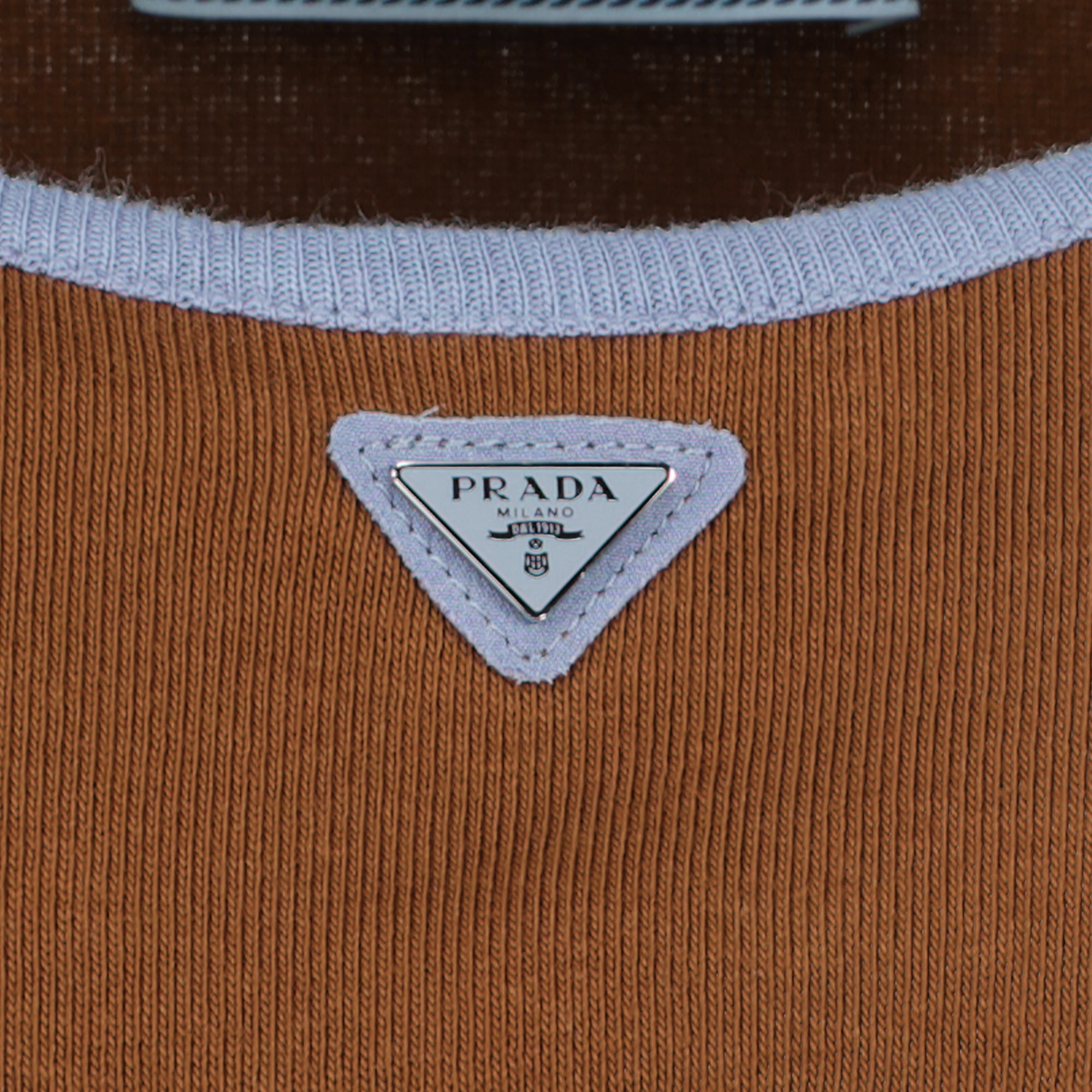 Image of the brown ribbed tank top from the brand Prada for women - Spring-Summer 2026 - Detailed view_2