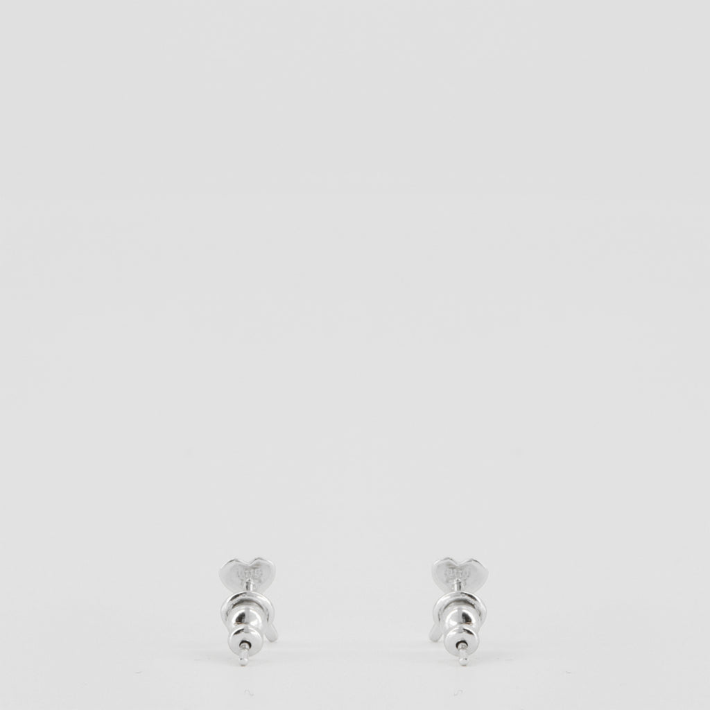Image of the silver heart-shaped Ami earrings from the brand Ami PARIS for Women - Spring-Summer 2026 - Back View