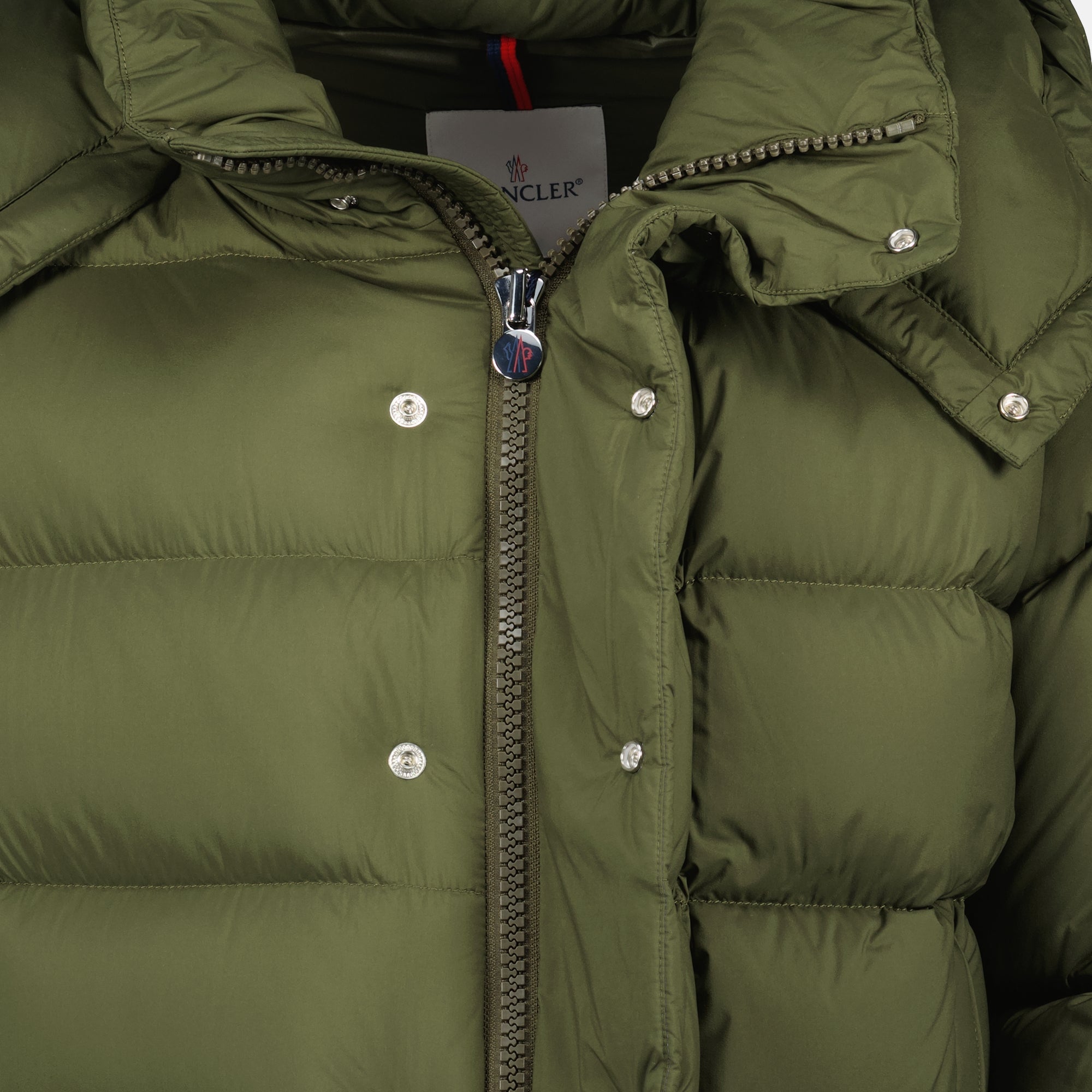Image of the Maya 70 khaki down jacket from the brand Moncler for Men - Autumn-Winter 2025 - Detailed View_1