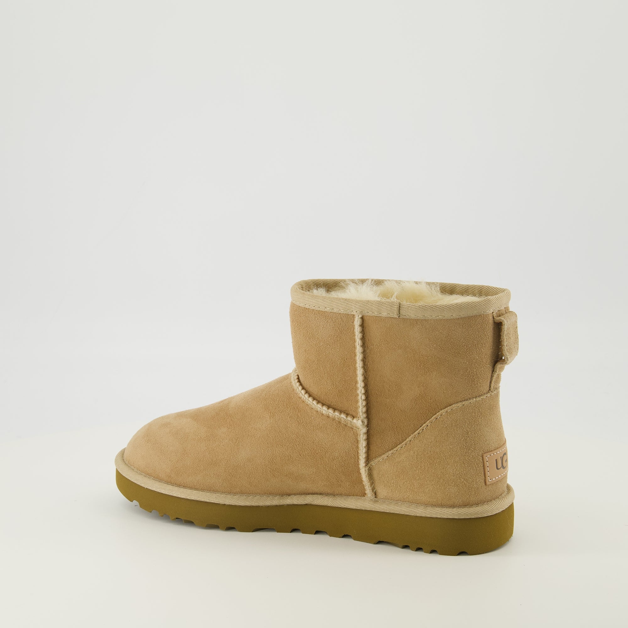 Image of the Ugg Classic Mini II beige ankle boots for women - Spring-Summer 2026 season - Three-quarter back right view
