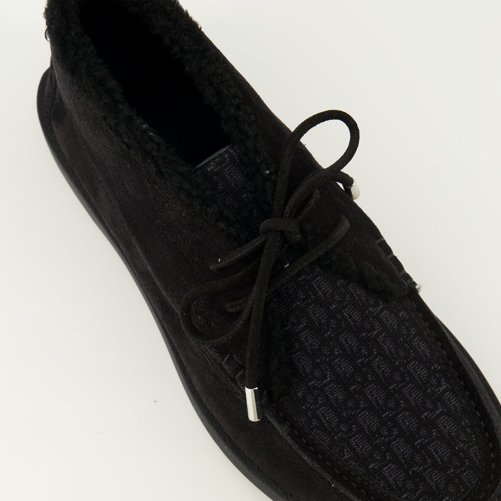 Image of the black Chukka boots from the brand Dior for Men - Spring-Summer 2026 - Detailed top view