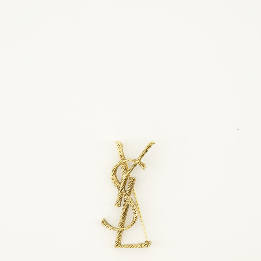 Image of the Saint Laurent Cassandre gold brass brooch for Women - Spring-Summer 2026 - Front View