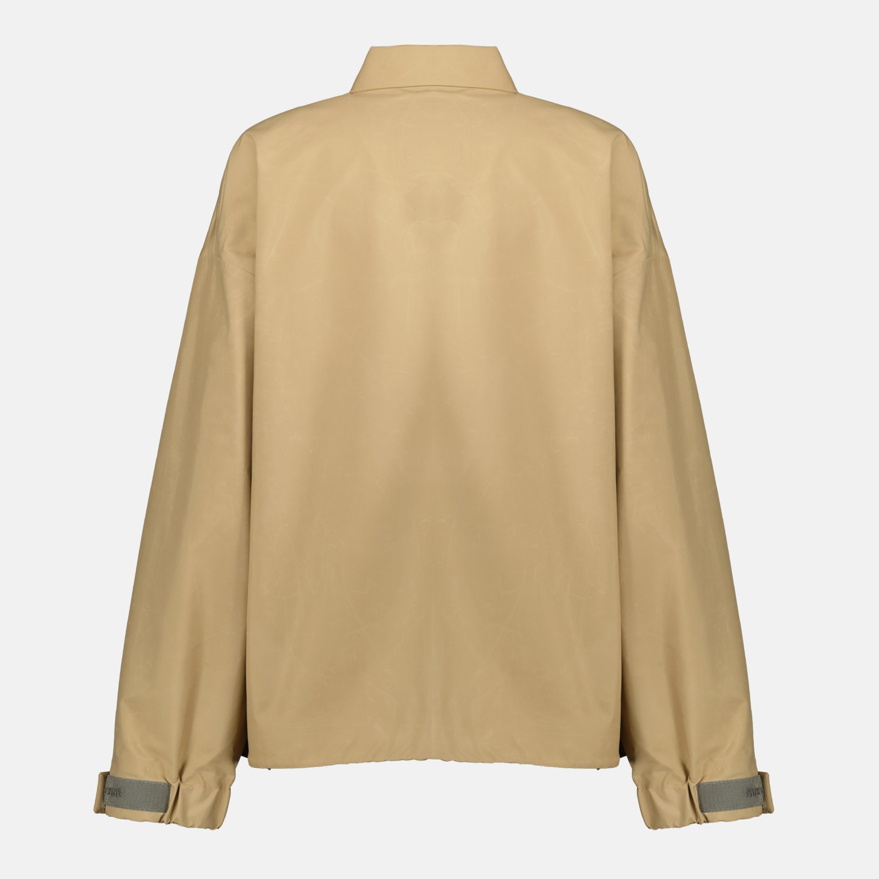 Imagen de la chaqueta cortavientos beige de la marca Miu Miu para Mujeres - Temporada Primavera-Verano 2026 - Vista Trasera