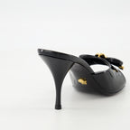 Open shoes Bow Heeled Mules Versace Black Femme