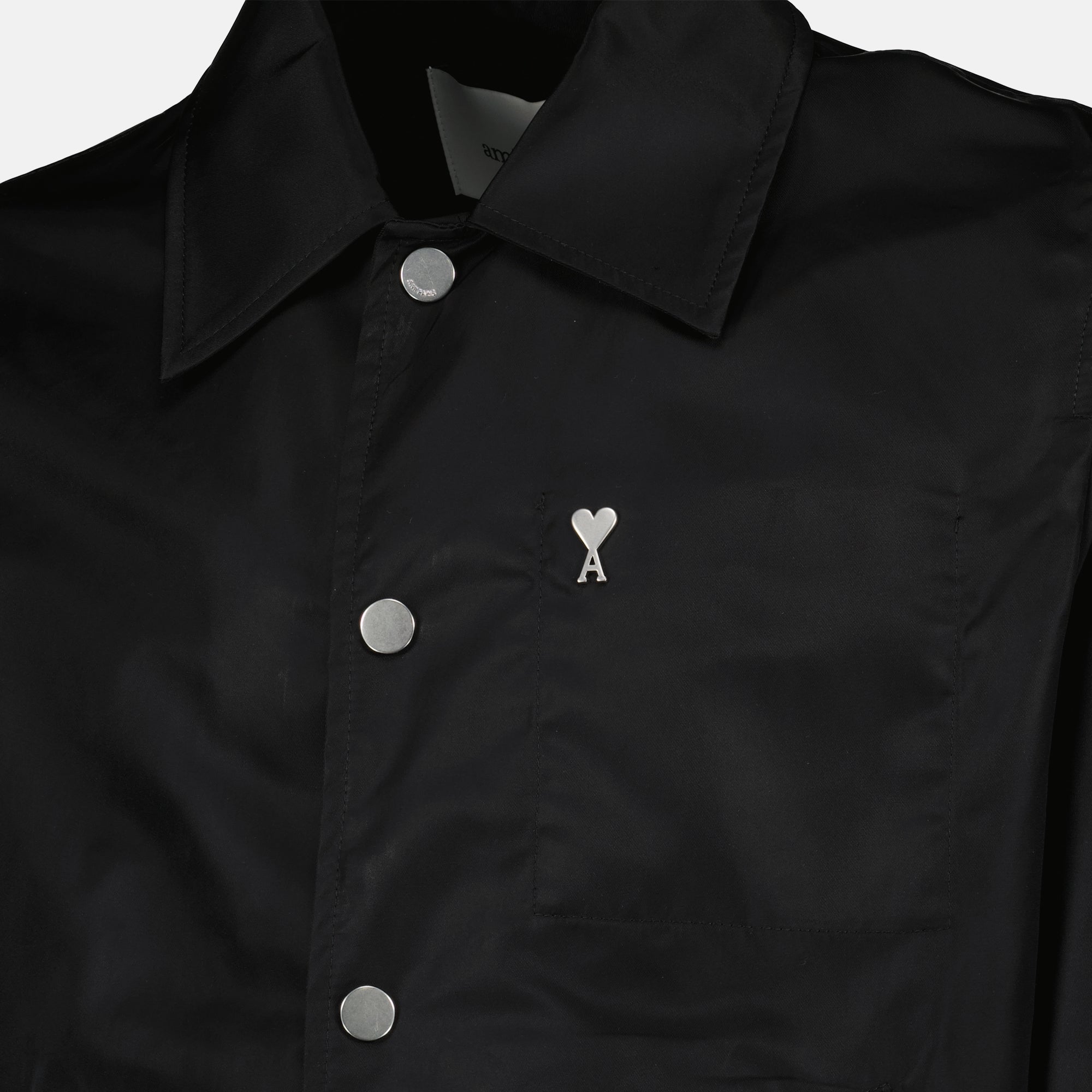 Image of the black nylon jacket from the brand Ami PARIS for Unisex - Spring-Summer 2026 - Detailed View_2