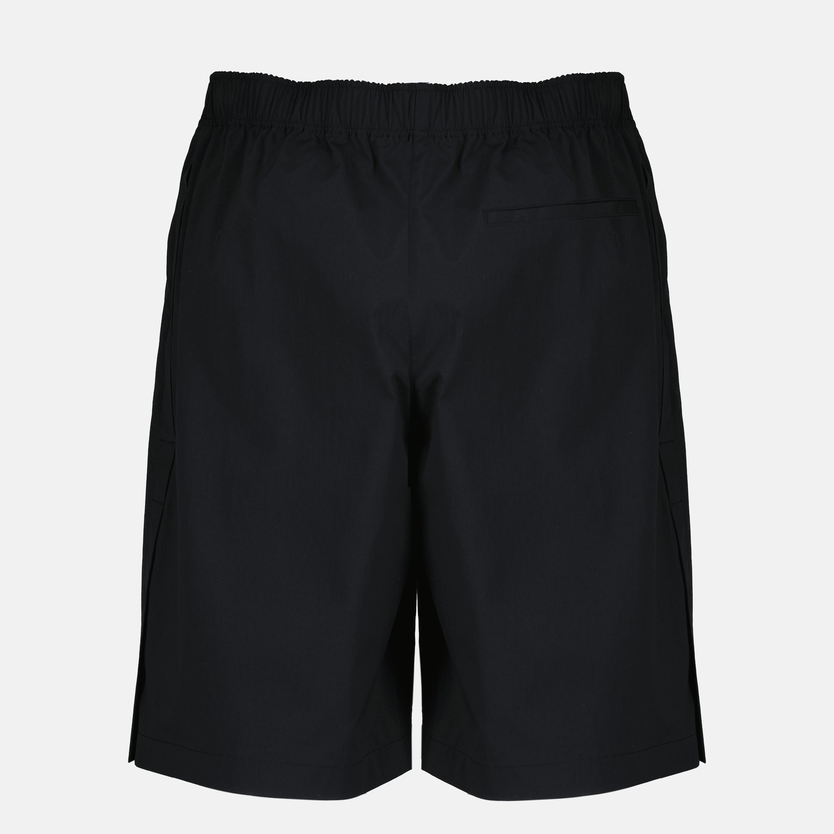 Image of the black Dior Montaigne shorts from the Dior Homme brand - Spring-Summer 2026 - Back View