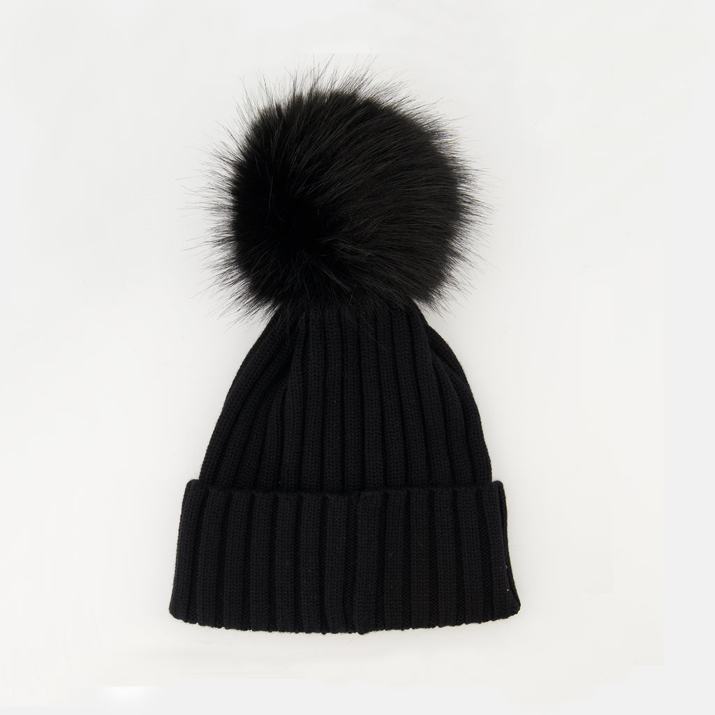 Image of the article Wool beanie with pompom from the brand Moncler for Women - Autumn-Winter Season 2025 - Back View