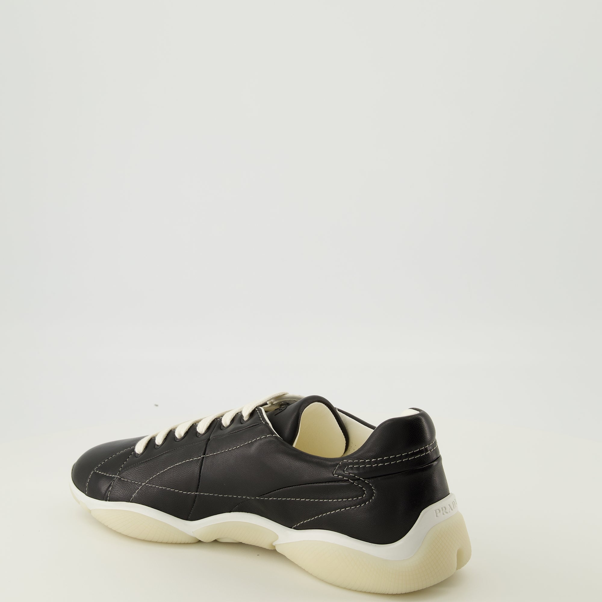 Image of the Prada Men's Black Leather America's Cup Sneakers - Fall-Winter 2025 - Three-quarter back right view