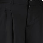 Image of the black wool Bermuda shorts from the brand Ami PARIS for Women - Spring-Summer Season 2026 - Detailed View_1