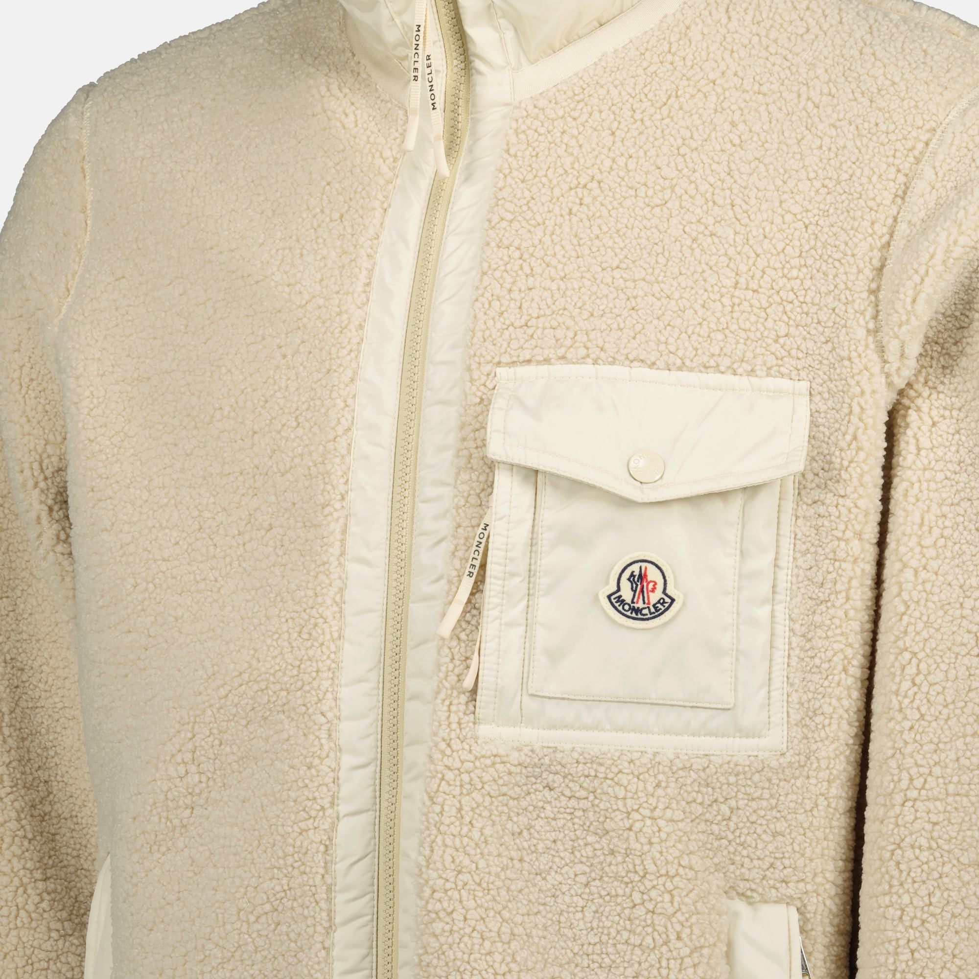 Image of Moncler's beige teddy zip-up jacket for Men - Fall-Winter 2025 - Detailed View 1