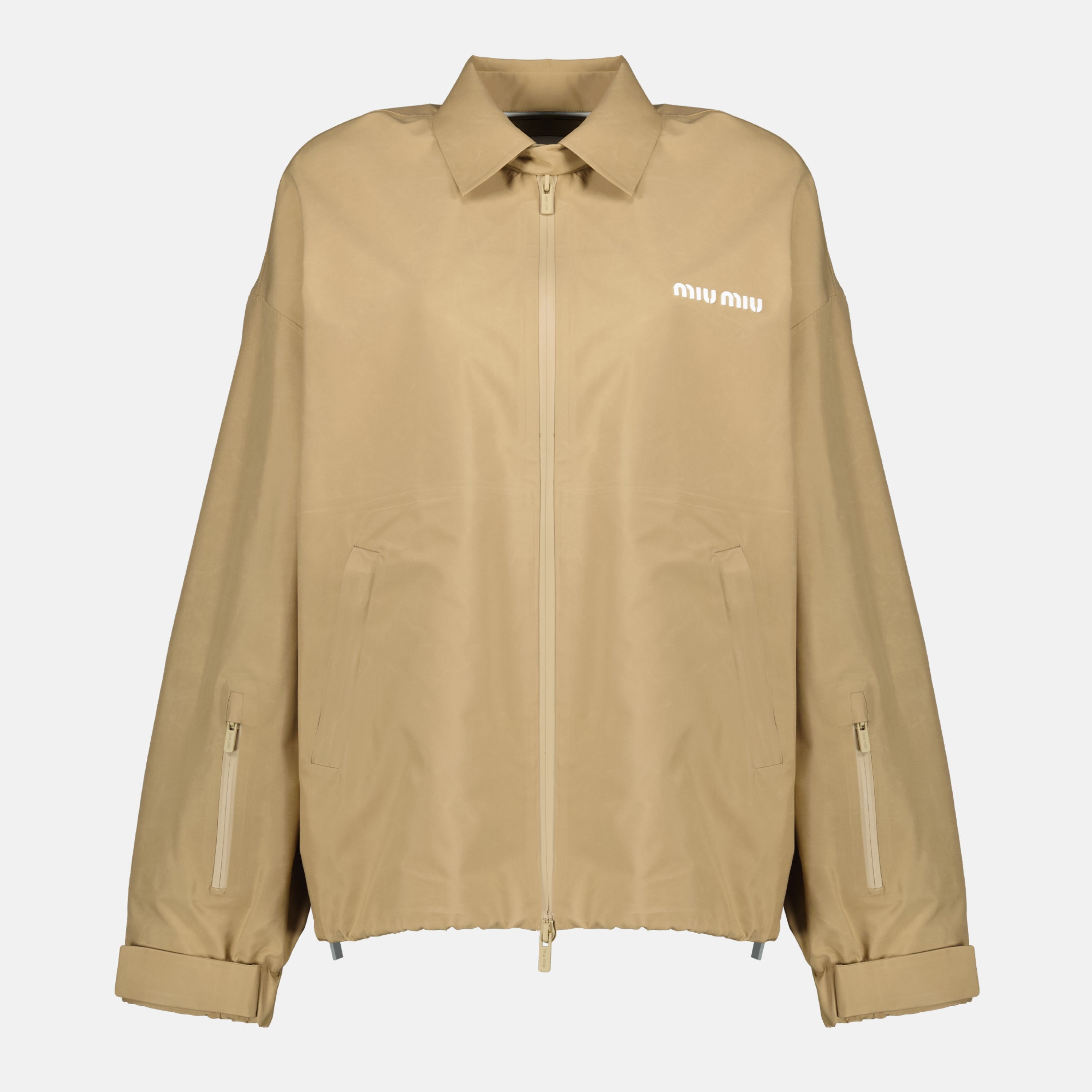 Imagen de la chaqueta cortavientos beige de la marca Miu Miu para Mujeres - Temporada Primavera-Verano 2026 - Vista Frontal