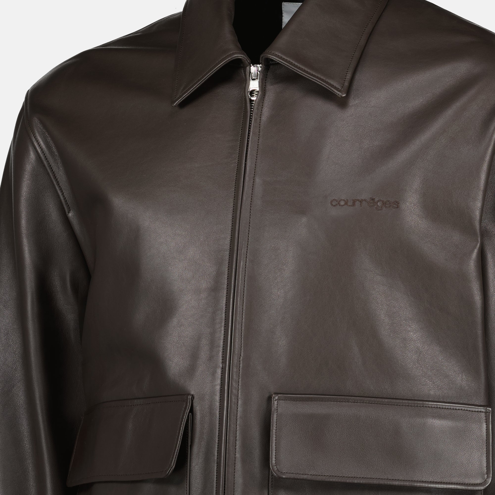 Image of the item Brown leather zip jacket by Courrèges for Men - Spring-Summer 2026 - Detailed view_1