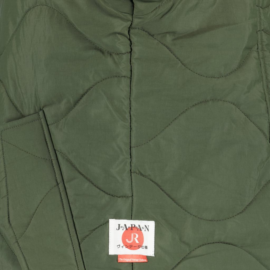 Imagem da jaqueta acolchoada caqui da marca Japan Rag para Homens - Temporada Outono-Inverno 2025 - Vista Detalhada_2