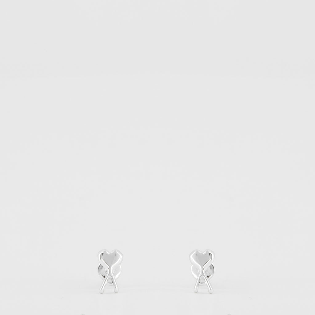 Image of the silver heart-shaped Ami earrings from the brand Ami PARIS for Women - Spring-Summer 2026 - Front View