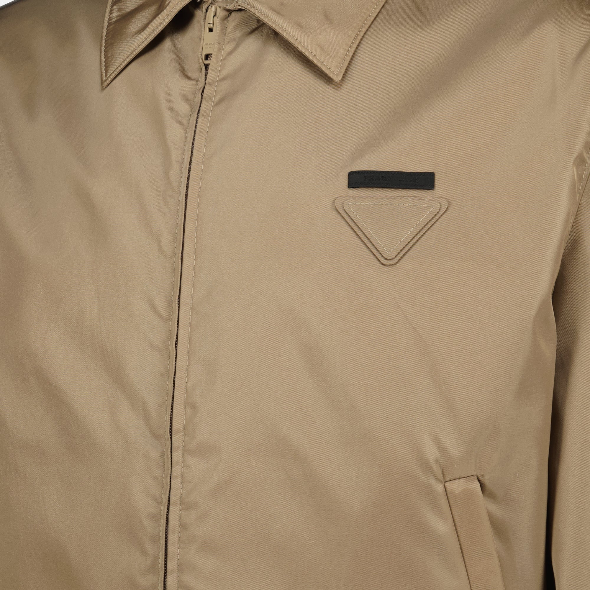 Image of the Prada beige nylon jacket for men - Spring-Summer 2026 - Detailed View 1