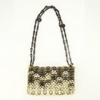 Imagen del bolso Iconic 1969 nano dorado y negro de la marca Rabanne para mujer - Temporada Primavera-Verano 2026 - Vista Frontal