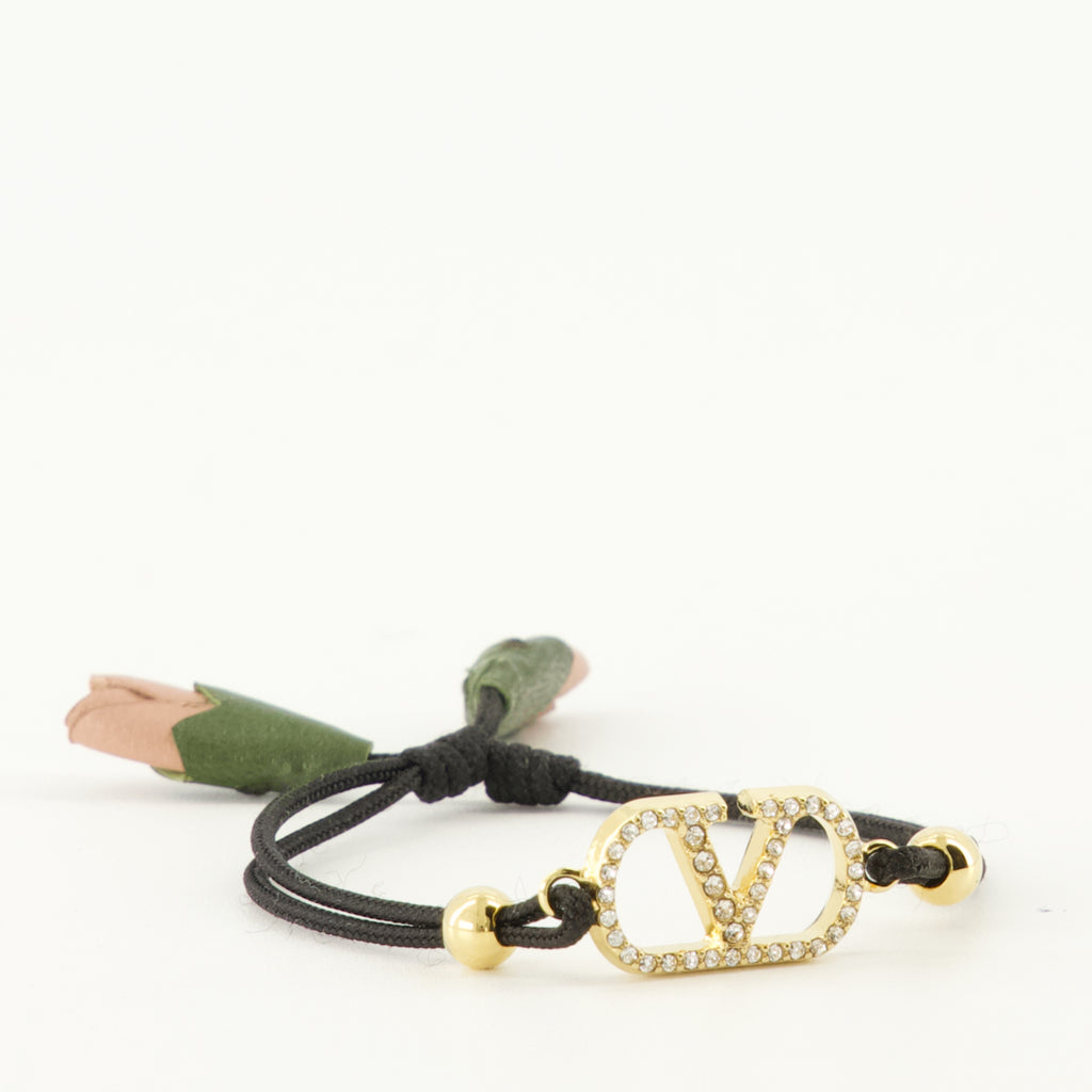 Image of the Vlogo bracelet with black cord from the brand Valentino Garavani for Women - Spring-Summer 2026 - Detailed View_2