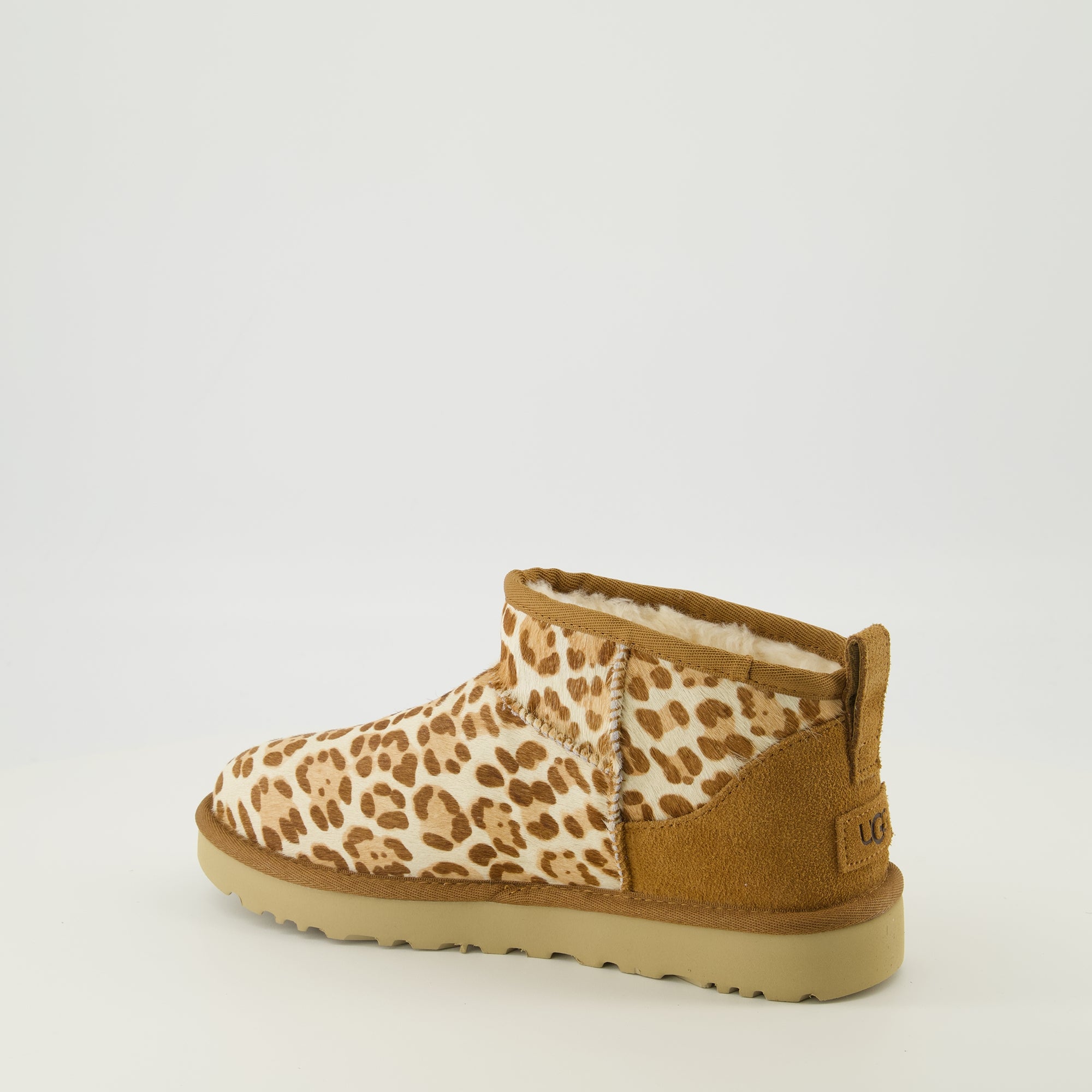 Image of the Ugg Classic Ultra Mini II leopard ankle boots for women - Spring-Summer 2026 season - Back right three-quarter view