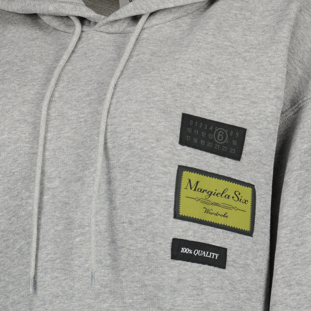 Image of the gray hoodie item from the brand Mm6 for Women - Spring-Summer 2026 - Detailed View_1