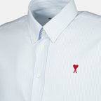 Image of the blue striped Ami heart shirt by the brand Ami PARIS for Unisex - Autumn-Winter 2025 - Detailed View_1