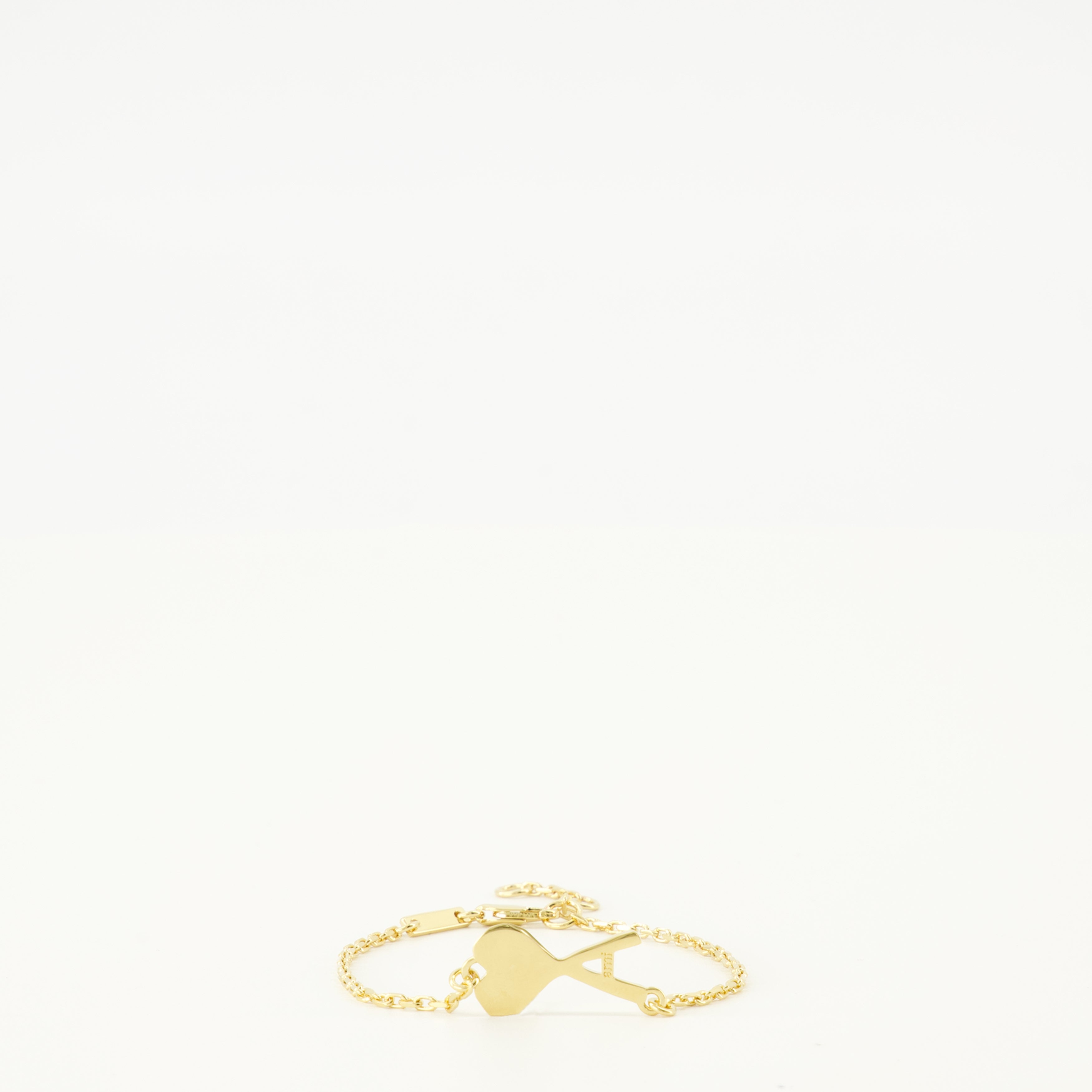 Image of the AMI golden heart bracelet from the brand Ami PARIS for Unisex - Spring-Summer 2026 - Front View