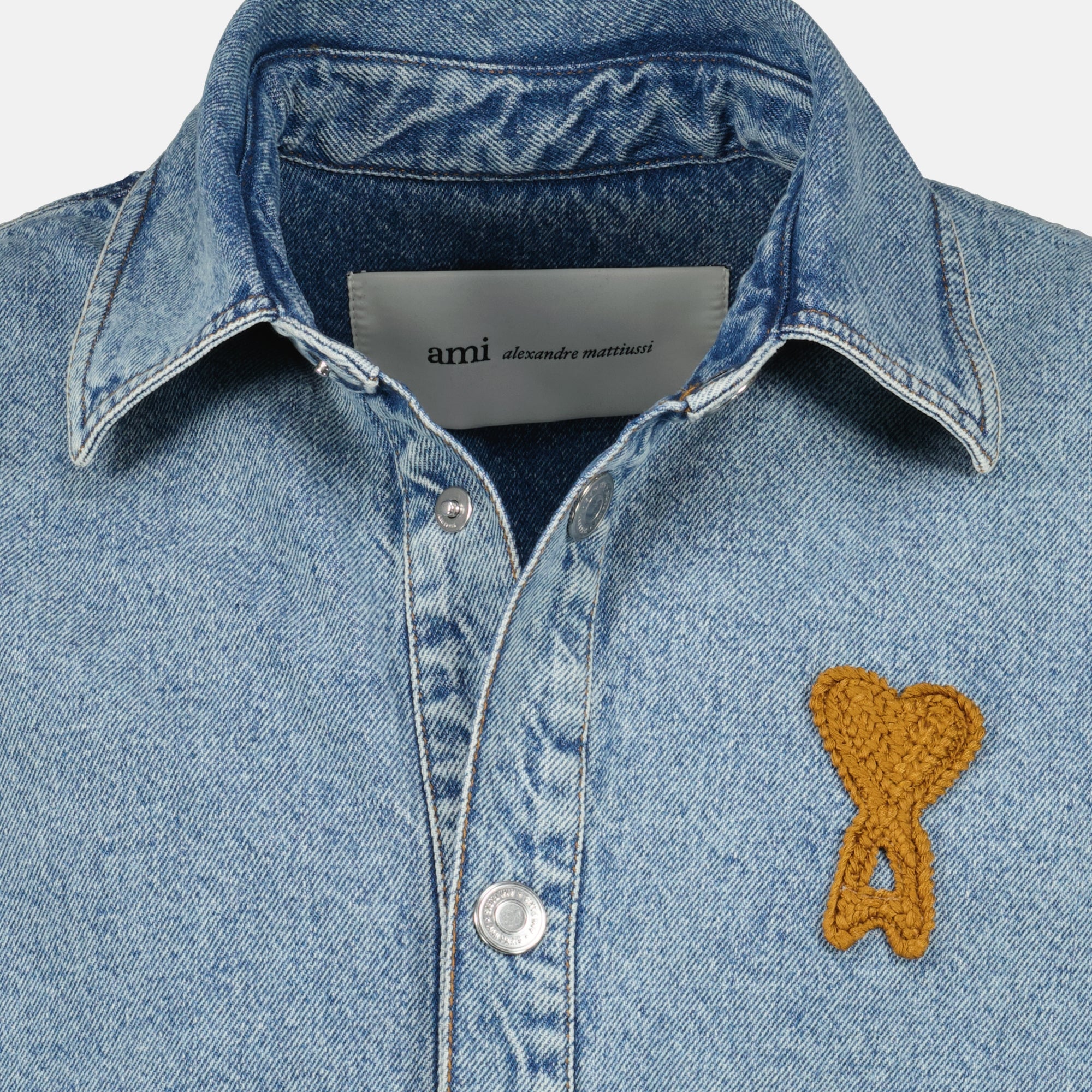 Image of the AMI blue crochet heart denim shirt by Ami PARIS for Unisex - Spring-Summer 2026 - Detailed View_2