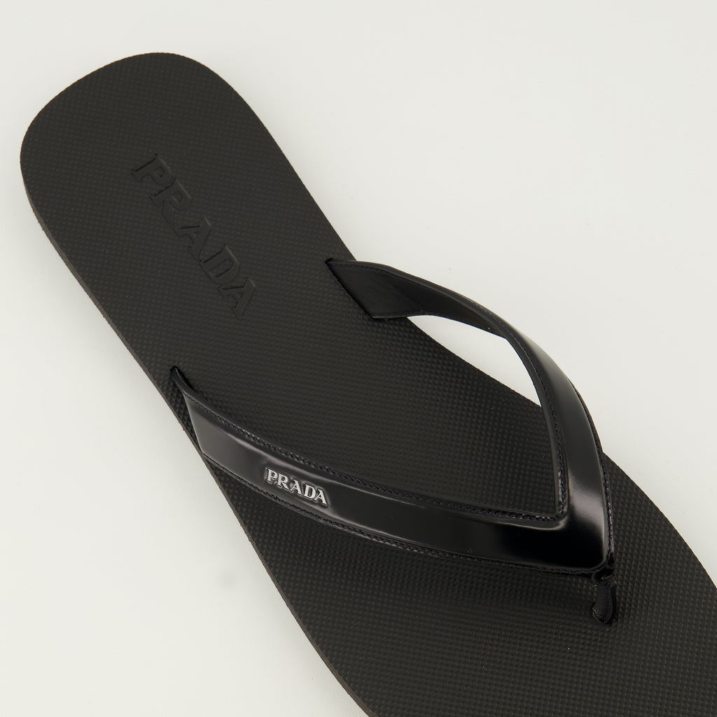 Image of the article Black brushed leather flip flops by Prada for Men - Spring-Summer 2026 - Top detailed view