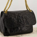 Imagem da mala Niki medium em couro vintage da marca Saint Laurent para Mulheres - Temporada Outono-Inverno 2025 - Vista Detalhada_2