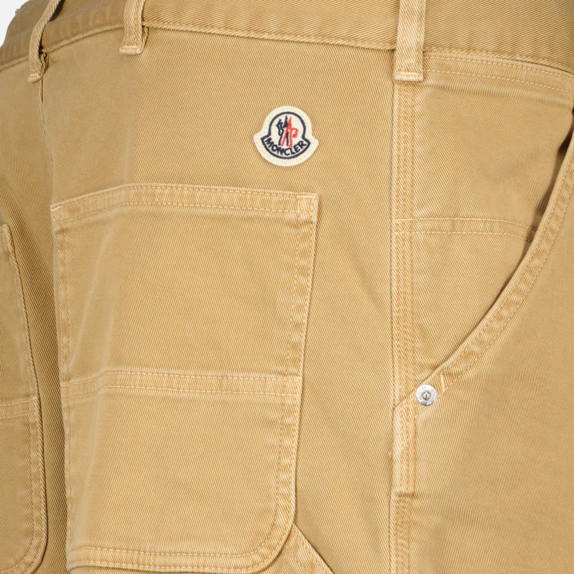 Image of the beige cargo pants by Moncler for Men - Spring-Summer 2026 - Detailed View_1