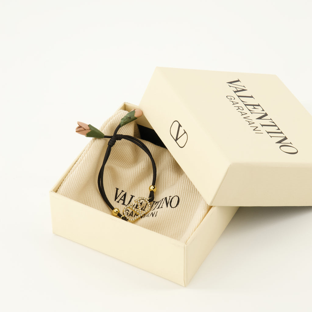 Image of the Vlogo bracelet with black cord from the brand Valentino Garavani for Women - Spring-Summer 2026 - Detailed View_3