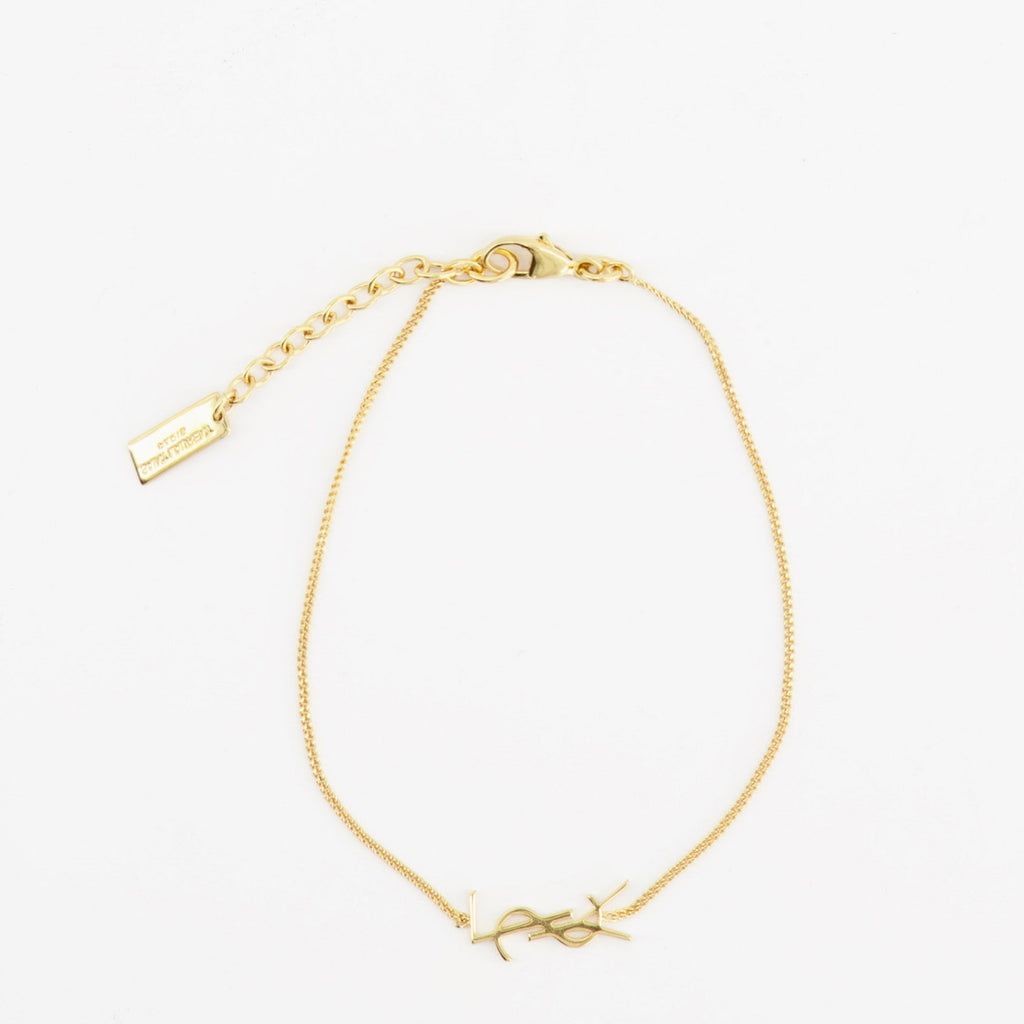 Imagen del brazalete Cassandre dorado de la marca Saint Laurent para Hombre - Temporada Primavera-Verano 2022 - Vista Trasera