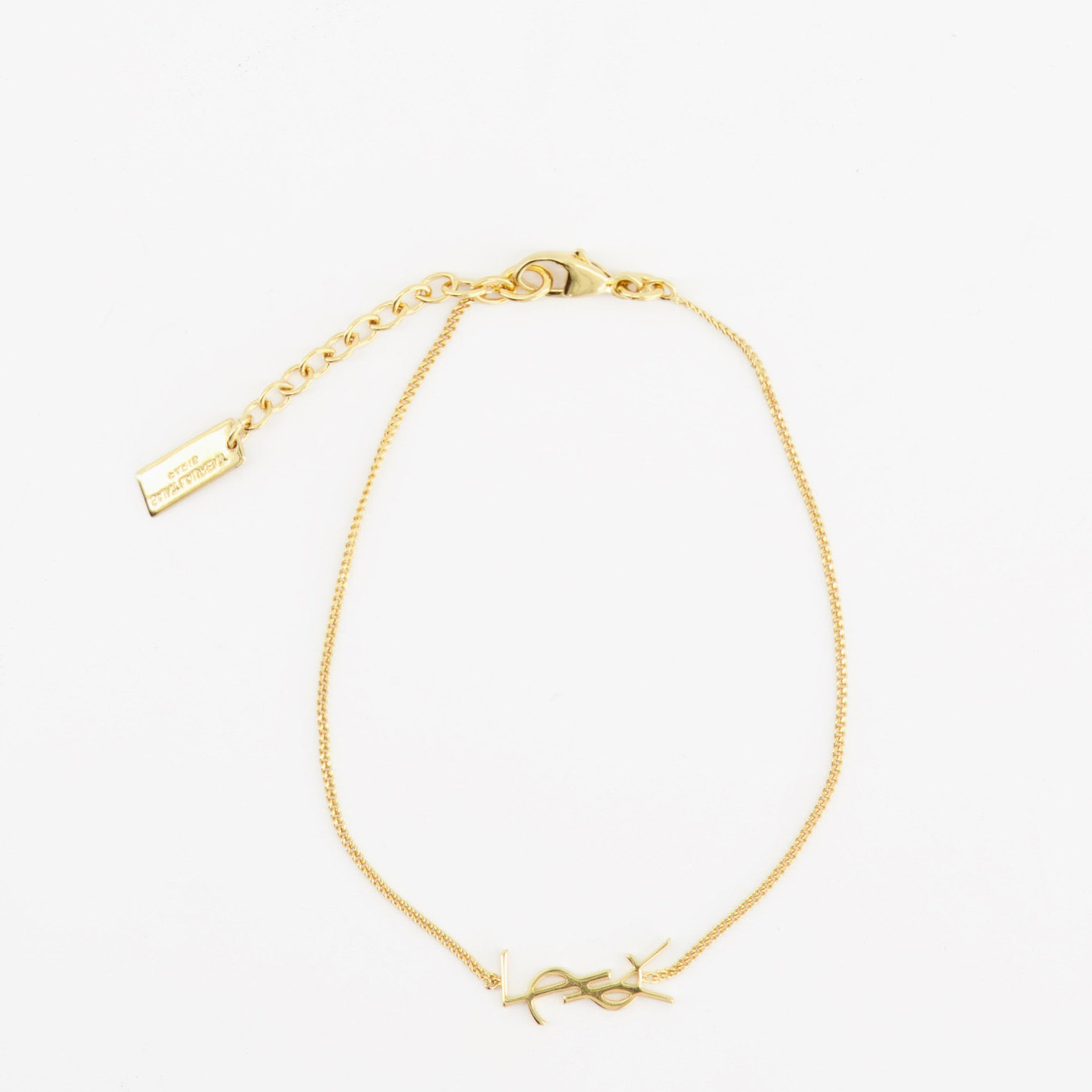 Imagen del brazalete Cassandre dorado de la marca Saint Laurent para Hombre - Temporada Primavera-Verano 2022 - Vista Trasera