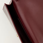 Image of the Saint Laurent Kate Clutch bag in burgundy patent leather for Women - Autumn-Winter 2025 Season - Detailed View_3