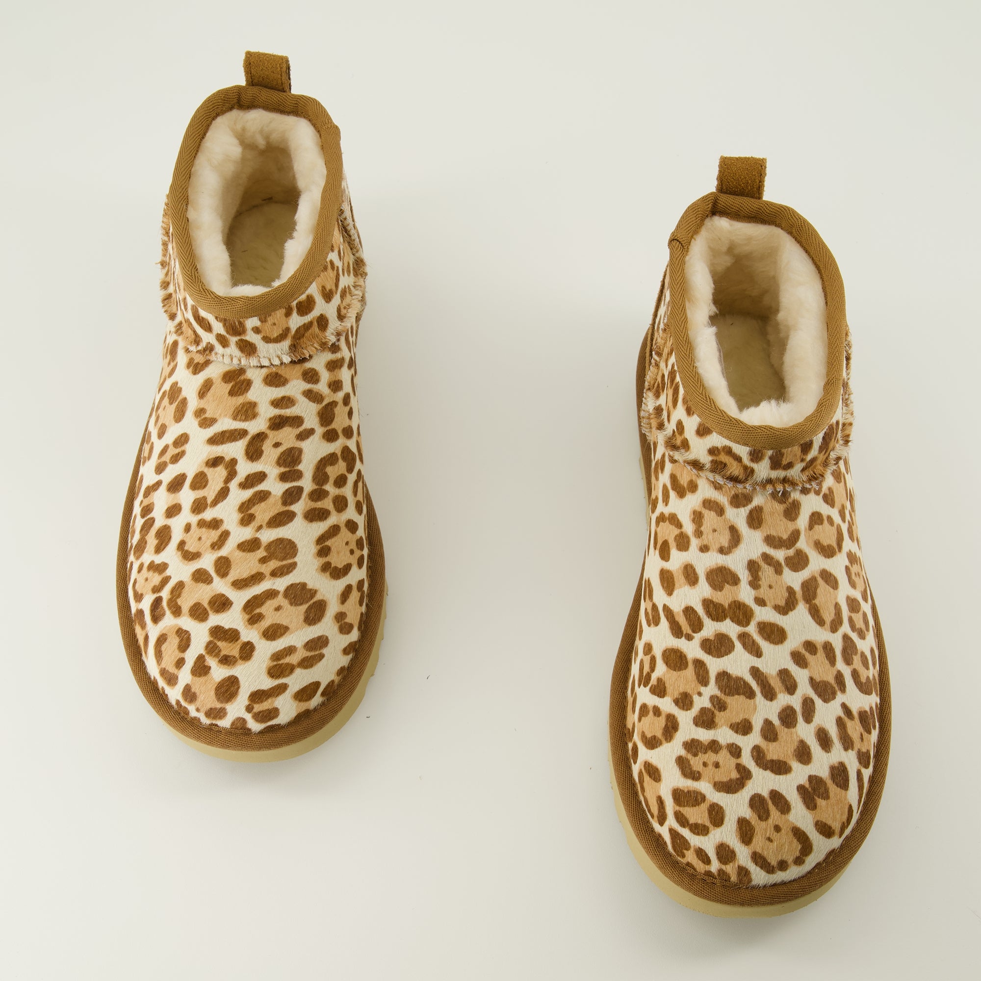 Image of the Ugg Classic Ultra Mini II leopard ankle boots for women - Spring-Summer 2026 season - Top view of the pair of shoes