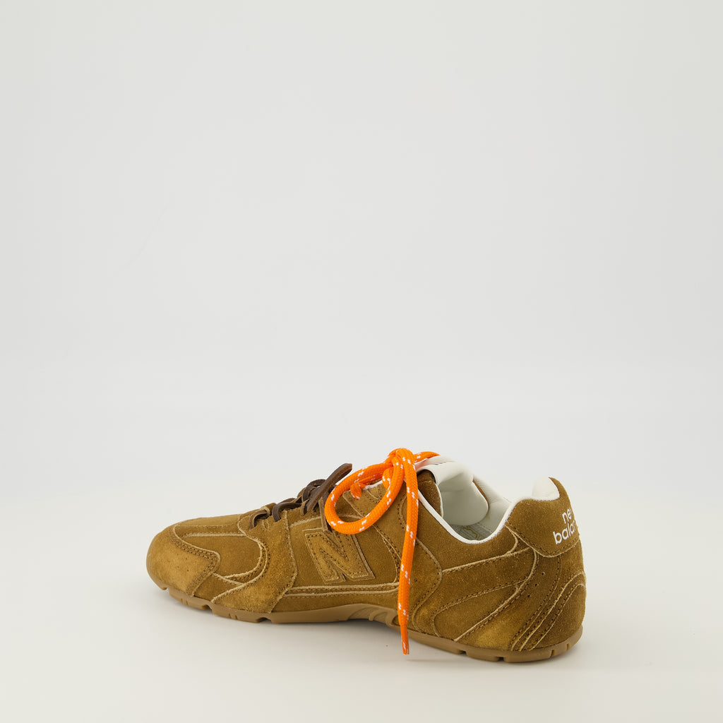 Image of the New Balance x MiuMiu 530 SL brown sneakers by Miu Miu for Women - Spring-Summer 2026 - Three-quarter back right view