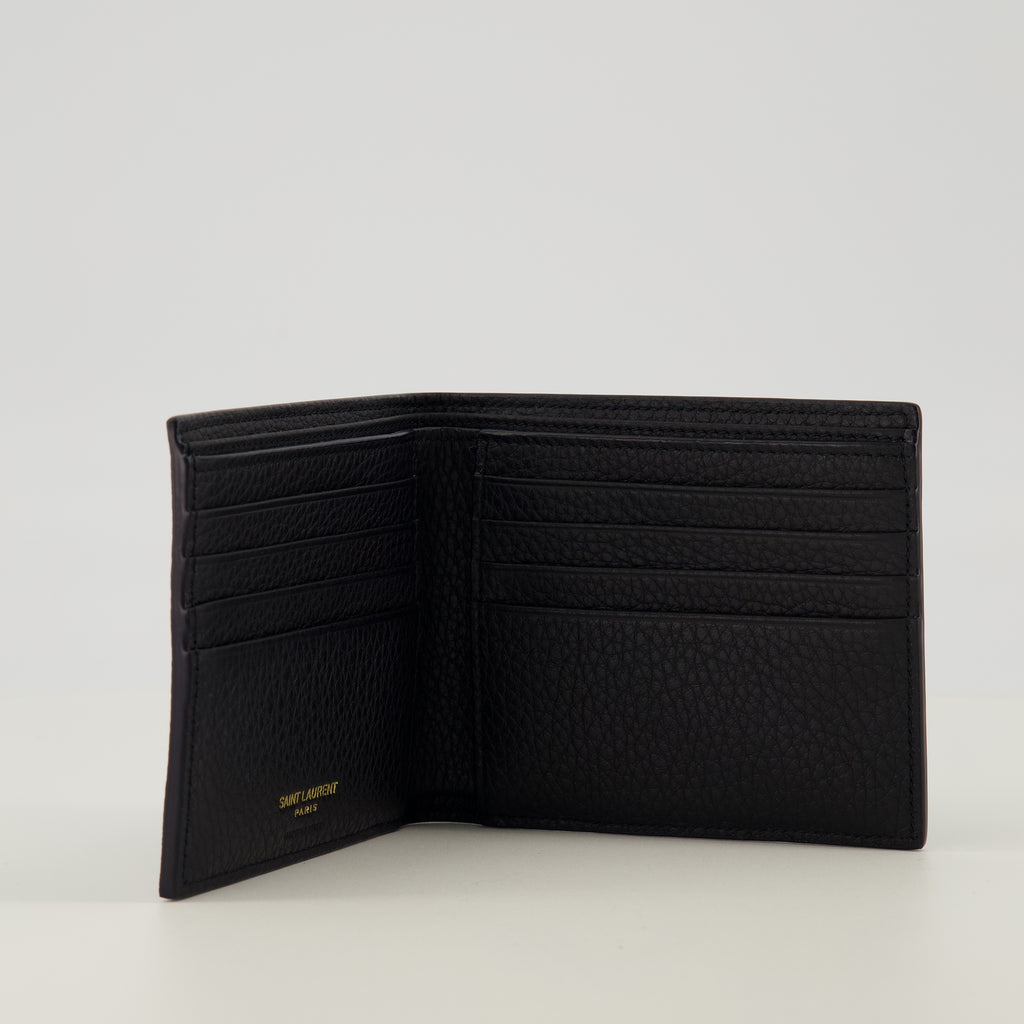 Image of the Tiny Cassandre black and gold wallet from the brand Saint Laurent for Men - Spring-Summer 2026 - Detailed View_2