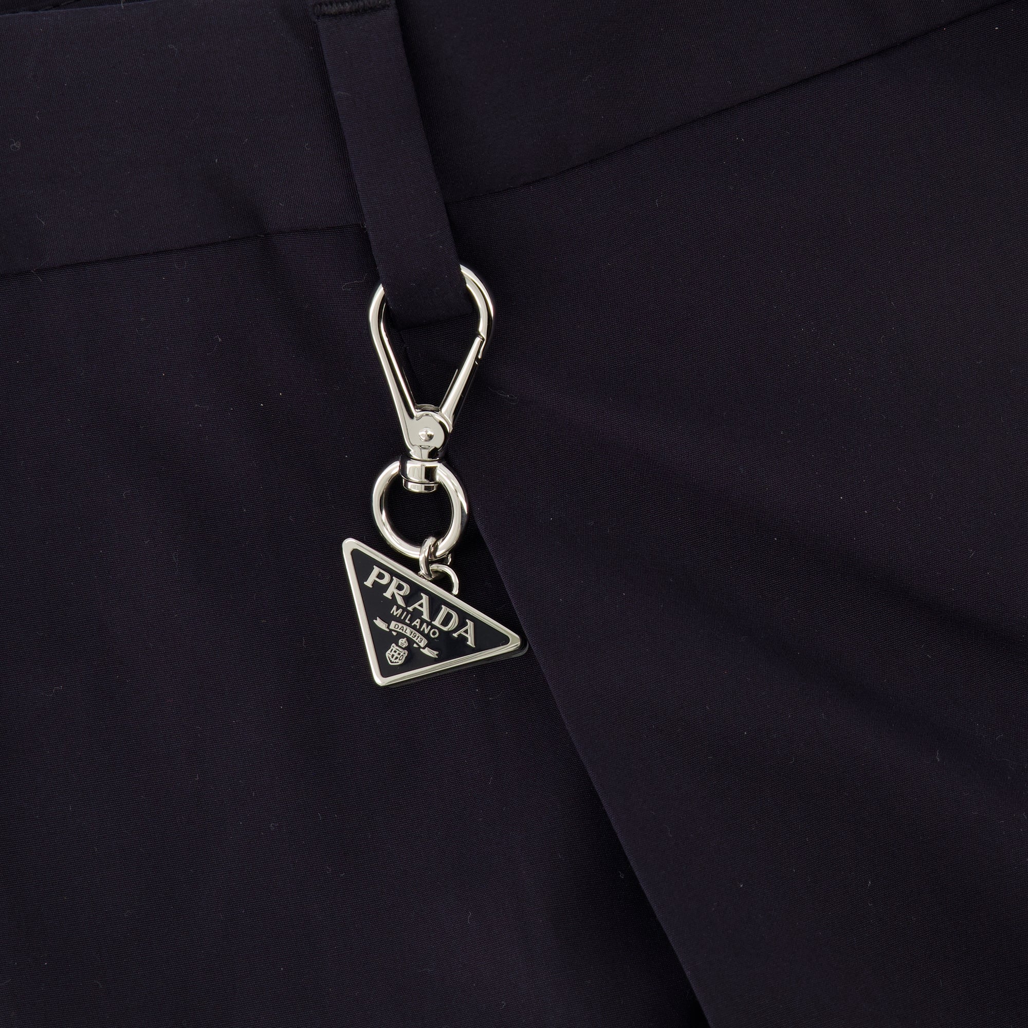 Image of the navy blue city trousers by Prada for Men - Spring-Summer 2026 - Detailed View_1