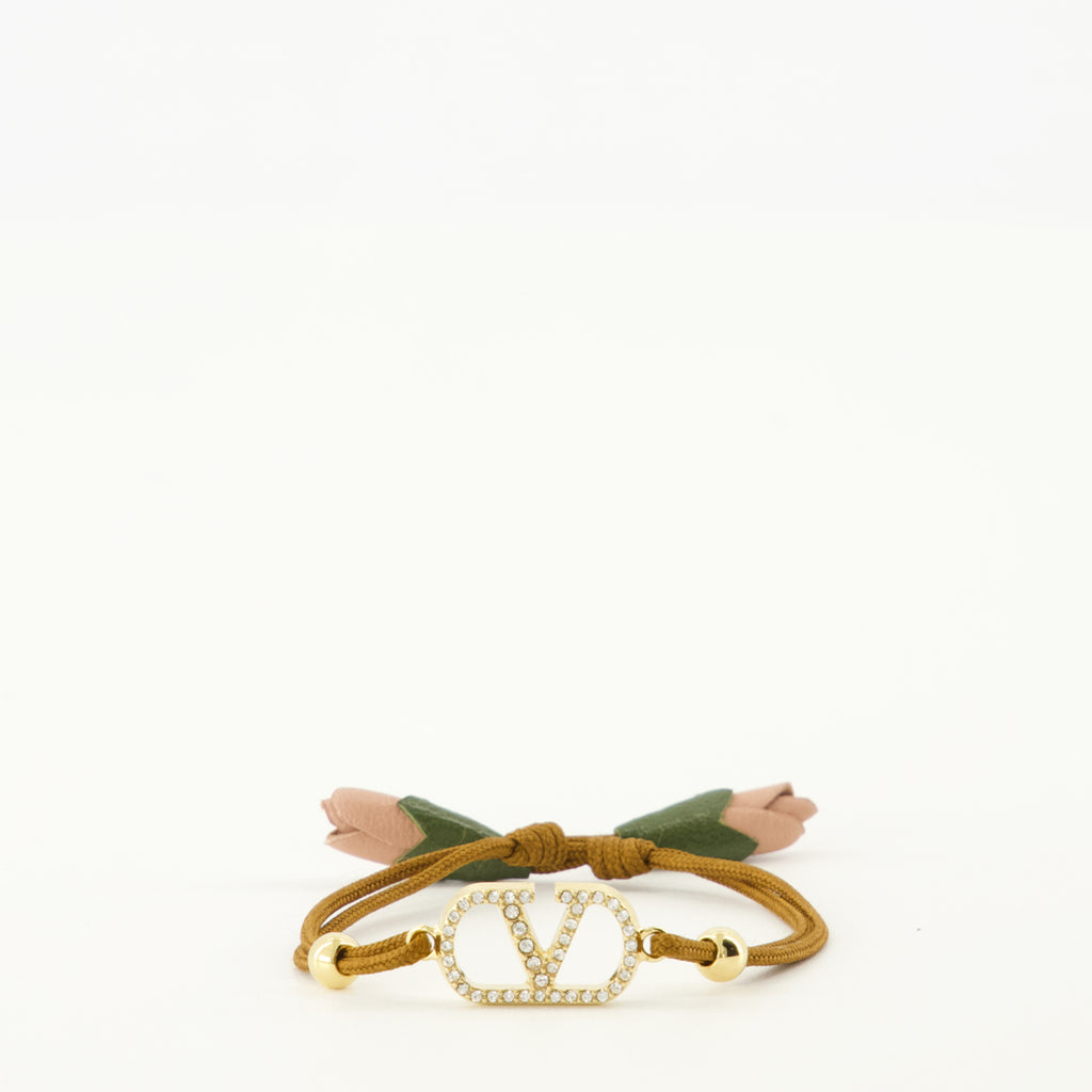 Image of the Vlogo Bracelet with brown cord by Valentino Garavani for Women - Spring-Summer 2026 - Front View
