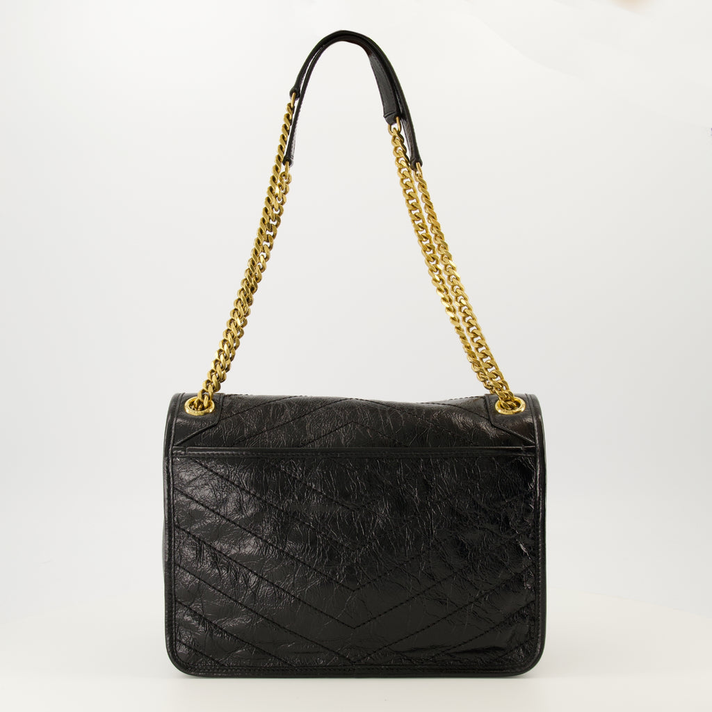 Image of the Saint Laurent brand Niki medium vintage leather bag for Women - Autumn-Winter 2025 Season - Back View