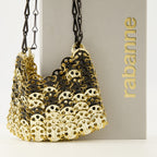 Imagen del bolso Iconic 1969 nano dorado y negro de la marca Rabanne para mujer - Temporada Primavera-Verano 2026 - Vista Detallada_2