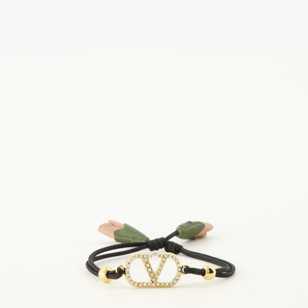 Image of the Vlogo bracelet with black cord from the brand Valentino Garavani for Women - Spring-Summer 2026 - Front View