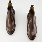 Image of the Pas Des Dieux ankle boots by Valentino Garavani for Men - Autumn-Winter 2025 Season - Top view of the pair of shoes