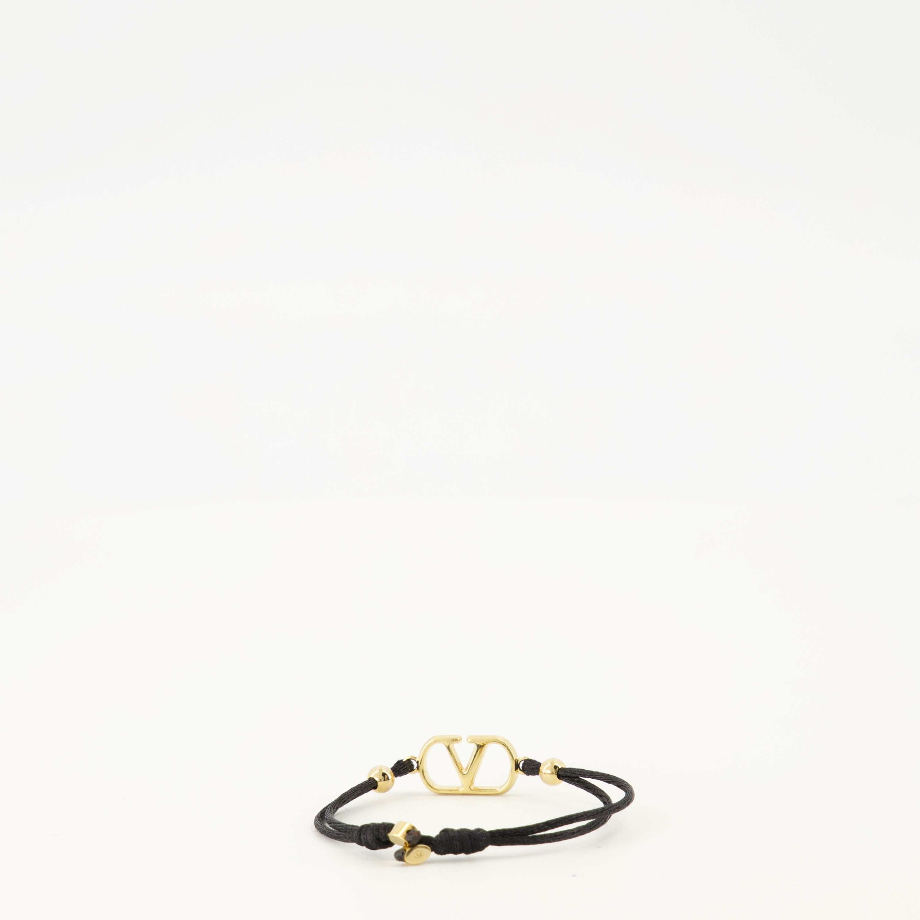 Image of the Vlogo bracelet with black cord and Swarovski® crystals by Valentino Garavani for Women - Spring-Summer 2026 - Back View