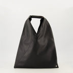 Imagen del bolso japonés negro pequeño de la marca Mm6 para mujeres - Temporada Primavera-Verano 2026 - Vista Frontal
