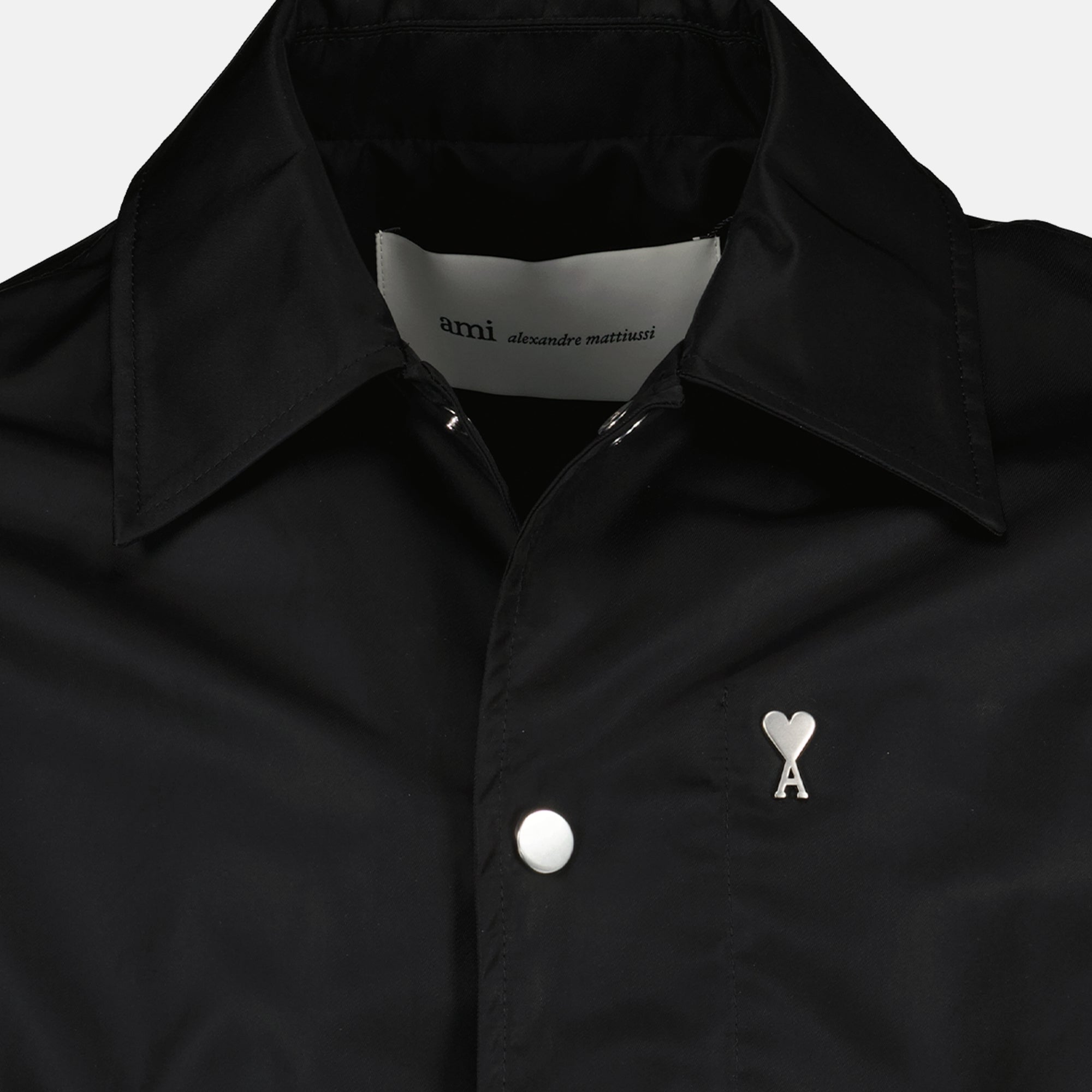 Image of the black nylon jacket from the brand Ami PARIS for Unisex - Spring-Summer 2026 - Detailed View_1